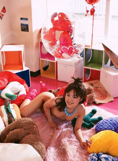 Delectable asian cutie with pig tails showing her plump boobs