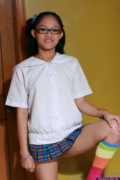 Japanese teen amateur strips off and unveils her tiny tits and shaved pussy