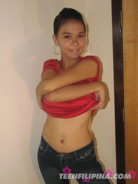 Asian teenager strips and shows her tiny tits and pussy