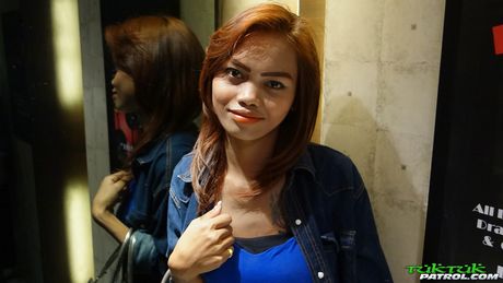 Asian teen Som strips and shows her tits and pussy in a public place