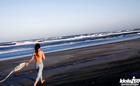 Hot japanese teen Yu Satome in jeans shows big hooters and sexy butt at beach